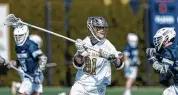  ?? Michael Miller/ISI Photos/Getty Images ?? Notre Dame’s Will Donovan makes a pass during a game against Georgetown at Arlotta Stadium on Feb. 25 in South Bend, Indiana.