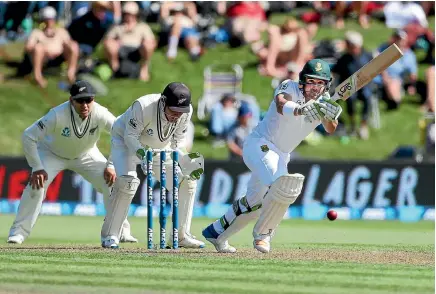  ?? PHOTO: GETTY IMAGES ?? Dean Elgar works a ball through mid wicket during his unbeaten century against New Zealand in Dunedin yesterday.