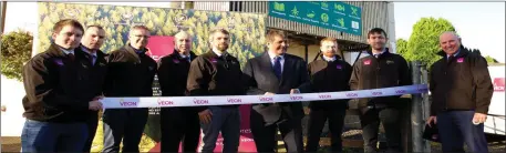  ??  ?? Colm Hobbins, extreme left, with Minister Doyle at the opening of Veon’s new office in Drumshanbo last year.