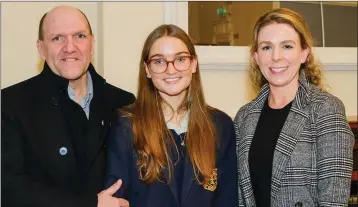  ??  ?? Winner Emilia Conroy with her dad Gerry and her teacher at St Gerard’s, Alex Kavanagh.