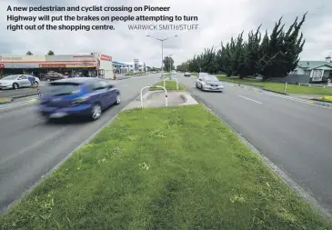  ?? WARWICK SMITH/STUFF ?? A new pedestrian and cyclist crossing on Pioneer Highway will put the brakes on people attempting to turn right out of the shopping centre.