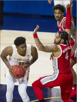  ?? Robert Franklin The Associated Press ?? Notre Dame’s Juwan Durham, left, is pressured by Ohio State’s Duane Washington Jr. during Tuesday’s game in South Bend, Ind. Ohio State won 90-85.