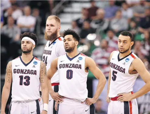  ?? GENE SWEENEY JR. / GETTY IMAGES ?? Is this the year the Gonzaga Bulldogs finally crash the Final Four party? Josh Perkins, from left, Przemek Karnowski, Silas Melson and Nigel Williams- Goss will give it a shot as the West Region’s No. 1 seed.