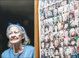  ?? Robert Gauthier Los Angeles Times ?? ONE HUNDRED AND NINETEEN victims of COVID-19 look out at Lois Jones from the curio cabinet where she has taped up an L.A. Times front page.