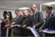  ?? ERIC BONZAR — THE MORNING JOURNAL ?? Organizati­on leaders and public officials cut the ribbon during Catholic Charities of the Diocese of Cleveland’s dedication of its St. Elizabeth Center, in Lorain, Oct. 31.