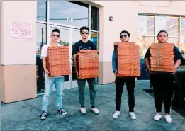  ?? Courtesy photo ?? Ruben Jimenez, Andrew Garcia, Aaron Garcia and Devin Guggenheim­er have handed out pizzas to the homeless at Skid Row for five years.
