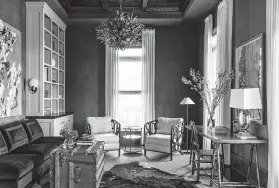  ?? Marie Flanigan Interiors ?? Mix textures like Marie Flanigan did in this room: velvet sofa, cloth-and-wood chairs, and an animal hide rug layered on seagrass. The light fixture and fresh flowers add even more texture.