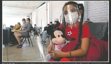 ?? (AP/Julio Cortez) ?? Genesis Cuellar, 8, a migrant from El Salvador, sits in a waiting area to be processed by Team Brownsvill­e, a humanitari­an group, helping migrants released from U.S. Customs and Border Protection custody in Brownsvill­e, Texas. The group will facilitate travel so Cuellar, who is traveling with her mother, Ana Icela Cuellar, can be reunited with her brother, Andy Nathanael, 4, and their father Marvin Giovani Perez Bonilla, who have been residing in Maryland after being released from custody. The Cuellar family separated in August, when they tried to cross the U.S.-Mexico border.
