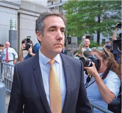  ?? CRAIG RUTTLE/AP ?? Michael Cohen, former personal lawyer to President Donald Trump, leaves federal court after reaching a plea agreement Tuesday.