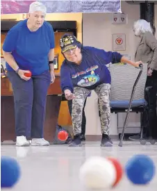  ??  ?? LEFT: Julie King, left, and fellow Army veteran Fern Honawa practice boccia ball at the Raymond G. Murphy VA Medical Center’s recreation building in anticipati­on for the 2018 National Veterans Golden Age Games, which Albuquerqu­e will host in August.