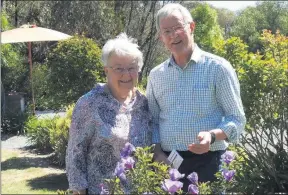  ?? ?? BLOOMING GOOD DAY: Rae Decker, Horsham, and Harvey Champness, Kaniva, admire a native hibiscus at Noelene and Paul Kelly’s property during a Gardens of Haven event at the weekend.