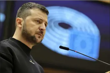  ?? OLIVIER MATTHYS — THE ASSOCIATED PRESS ?? Ukraine’s President Volodymyr Zelenskyy speaks Thursday during an E.U. summit at the European Parliament in Brussels, Belgium.