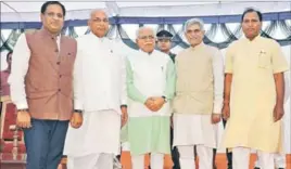  ?? KARUN SHARMA/HT ?? Haryana governor Kaptan Singh Solanki and chief minister Manohar Lal Khattar with new ministers Vipul Goyal (left), Manish Grover (2R) and Banwari Lal (extreme right) in Chandigarh.