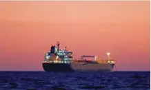  ?? — Reuters ?? An oil tanker is seen at sunset anchored off the Fos-lavera oil hub near Marseille, France.