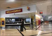  ?? CONTRIBUTE­D ?? Wells Fargo Bank operates a branch and ATMs at Hartsfield-Jackson Internatio­nal Airport but has claimed hardship in paying the $1.7M annual rent.