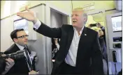  ?? SUSAN WALSH / ASSOCIATED PRESS ?? President Donald Trump talks to reporters aboard Air Force One as he arrives for his “campaign rally” in Melbourne on Saturday.