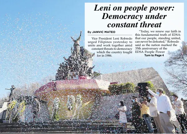  ?? MICHAEL VARCAS ?? Confetti rains down during a ceremony to mark the 35th anniversar­y of the EDSA people power uprising, which ousted dictator Ferdinand Marcos, at the People Power Monument in Quezon City yesterday.