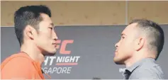  ??  ?? Dong Hyun Kim of South Korea (left) and Colby Covington of the US face off during the UFC Fight Night media event in Singapore. — AFP photo