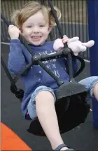  ??  ?? Rose McCarthy trying the swing at the grand opening.