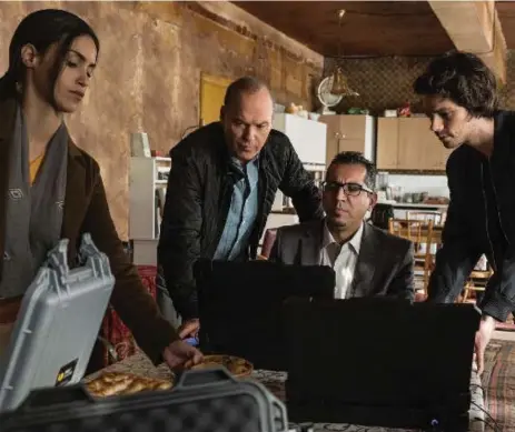  ?? CHRISTIAN BLACK/LIONSGATE VIA THE ASSOCIATED PRESS ?? From left, Shiva Negar, Michael Keaton, Nej Adamson and Dylan O’Brien star in the written-by-committee American Assassin.