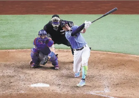  ?? Sean M. Haffey / Getty Images ?? The Rays’ Willy Adames, above, strikes out against the Dodgers’ Blake Treinen to end the Game 5 of the World Series. Tampa Bay had the potential tying run at the plate in the ninth after Manuel Margot, below, had singled to open the inning.