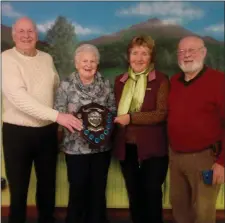  ??  ?? The Jackie Maher Memorial Plaque was presented to the winners of the Greenhills doubles tournament recently and pictured were Claire Woods and Mrs Maher with Jimmy Flood and club chairman Jack Howell.