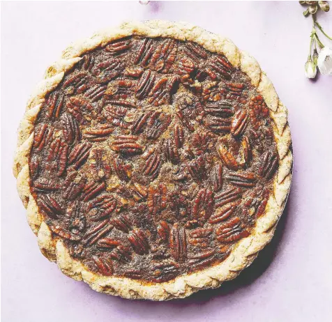  ?? D.L. ACKEN ?? Grated lemon zest adds dimension to the rich filling of Jana Roerick's decadent pecan pie.