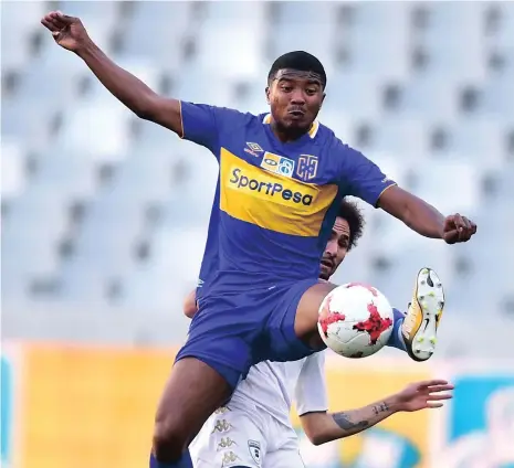  ?? Picture: PHANDO JIKELO/ANA PICTURES ?? LYLE IN CONTROL: Cape Town City midfielder Lyle Lakay beats Daylon Claasen of Wits to the ball at Cape Town Stadium yesterday. City beat Wits 1-0 in the first leg of the MTN 8 semi-final.