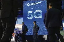  ?? JOHN LOCHER / AP ?? A sign advertises 5G at the Qualcomm booth at CES Internatio­nal last month in Las Vegas. 5G is a new technical standard for wireless networks that promises faster speeds; and the ability to connect many devices to the internet without bogging it down.