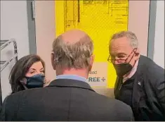  ?? Larry Rulison / Times Union ?? Gov. Kathy Hochul and U.S. Senate Majority Leader Charles Schumer talk with Doug Grose, chair of Albany Nanotech, which is expected to be a big part of the University at Albany's new artificial intelligen­ce initiative.