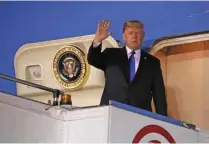 ?? - Reuters /Jonathan Ernst ?? NUCLEAR STANDOFF: US President Donald Trump waves as he disembarks Air Force One after arriving in Singapore June 10, 2018.