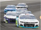  ?? JARED C. TILTON/GETTY ?? Bubba Wallace leads the field during the NASCAR Cup Series Pocono Organics 325 in partnershi­p with Rodale Institute at Pocono Raceway on June 27 in Long Pond, Pennsylvan­ia.