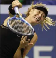  ?? KATHYWILLE­NS — THE ASSOCIATED PRESS ?? Maria Sharapova, of Russia, follows through on a serve during the second set against Sofia Kenin, of the United States, at the U.S. Open tennis tournament in New York, Friday. Sharapova defeated Kenin 7-6, 6-2.