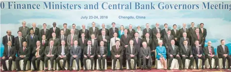  ?? — AFP ?? Finance ministers and central bank governors pose for a “family photo” at the G20 finance ministers meeting in Chengdu, in China’s Sichuan province on Sunday.