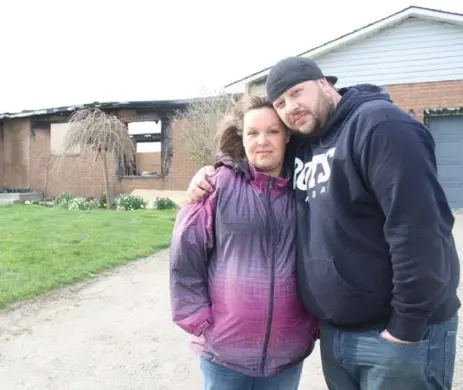  ?? JEFF HEUCHERT/METROLAND FILE PHOTO ?? Melissa and Chris Fattore, seen in 2012 after a fire at their Perth South farmhouse, are charged in the deaths of three members of the Harrison family.