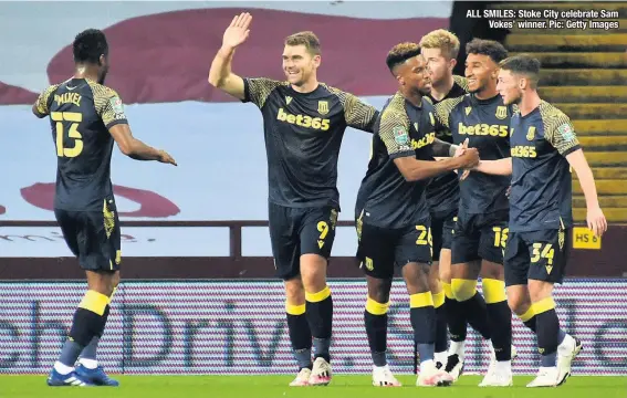  ??  ?? ALL SMILES: Stoke City celebrate Sam Vokes’ winner. Pic: Getty Images