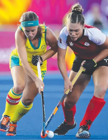  ?? Picture: GETTY IMAGES ?? Australia’s Emily Smith and Canada’s Brienne Stairs compete for the ball yesterday.