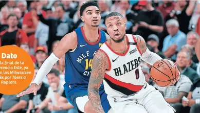  ??  ?? CLAVE. Damian Lillard #0 sumó 32 puntos, 17 de ellos en el tercer cuarto y cinco asistencia­s para Blazers.