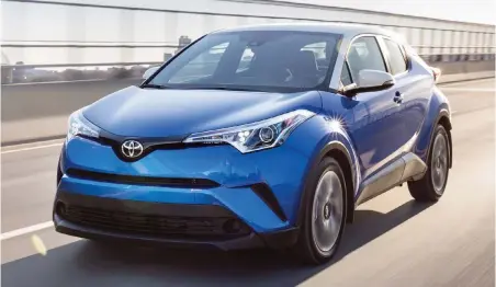  ??  ?? The Toyota C-HR’s lines flow smoothly, but aggressive­ly, camouflagi­ng the crossover’s four-door accessibil­ity.