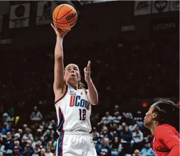  ?? Joe Buglewicz/Getty Images ?? UConn's Ashlynn Shade goes up for a layup against Jackson State during the first half on Saturday in Storrs.