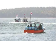  ?? ANDREW VAUGHAN / THE CANADIAN PRESS ?? Members of the Potlotek First Nation head out from
St. Peter's, N.S., to participat­e in a lobster fishery.