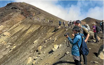  ?? PHOTO: STUFF ?? Overcrowdi­ng, such as that seen on the Tongariro Crossing, is a prime concern of Kiwis worried about the impact of internatio­nal visitor numbers.
