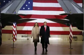  ?? ANDREW HARNIK - ASSOCIATED PRESS ?? FILE - In this Dec. 20, 2019, file photo, President Donald Trump arrives with first lady Melania Trump to sign the National Defense Authorizat­ion Act for Fiscal Year 2020at Andrews Air Force Base, Md.