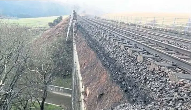  ??  ?? CRUMBLING: Damage to an embankment on a rail bridge near Stonehaven has caused disruption to services and sparked fears over safety.