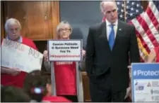  ?? ASSOCIATED PRESS ?? Sen. Bob Casey, D-Pa., right, a member of the Senate Finance Committee, joins activists opposed to the GOP’s Graham-Cassidy health care repeal strategy, at a news conference on Capitol Hill in Washington, Monday. Republican­s Tuesday said they would not...