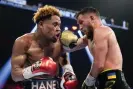  ?? night. Photograph: John Locher/AP ?? Devin Haney, left, takes a punch from Vasiliy Lomachenko during their undisputed lightweigh­t championsh­ip match on Saturday