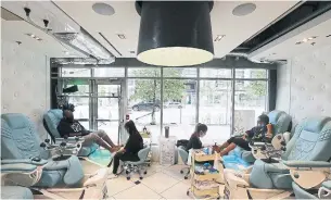  ?? STEVE RUSSELL TORONTO STAR ?? Customers in the pedicure area are kept apart unless they are in the same bubble at the Organic Nail Bar on Bathurst Street. Rosie DiManno has started making her appointmen­ts too.