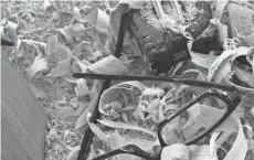  ?? PAUL A. SMITH / MILWAUKEE JOURNAL SENTINEL ?? Shavings and equipment lay on a tiller bench at a self bow workshop.