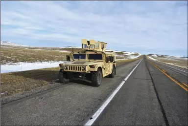  ?? (AP/Matthew Brown) ?? A U.S. Air Force security Humvee is seen on a central Montana highway in early February near Harlowton, Mont.