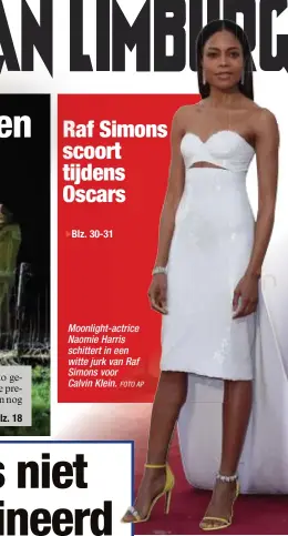  ?? FOTO AP ?? Moonlight-actrice Naomie Harris schittert in een witte jurk van Raf Simons voor Calvin Klein.